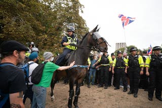 Mounted police officers are deployed during a protest by Abolish Asylum System and counter demonstrators at Castle Park in Bristol